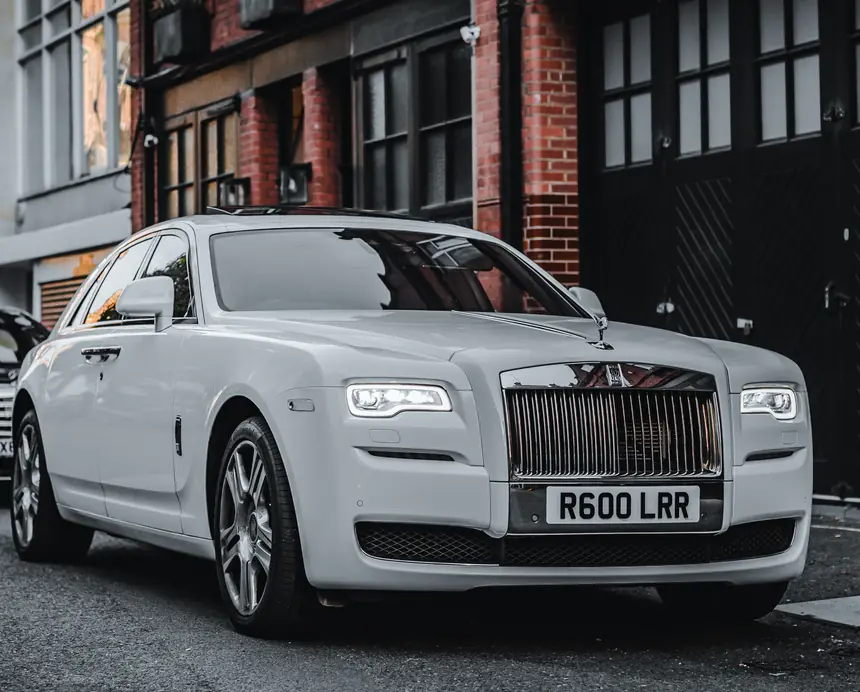Rolls-Royce Ghost wedding chauffeur car dressed with ribbon in London